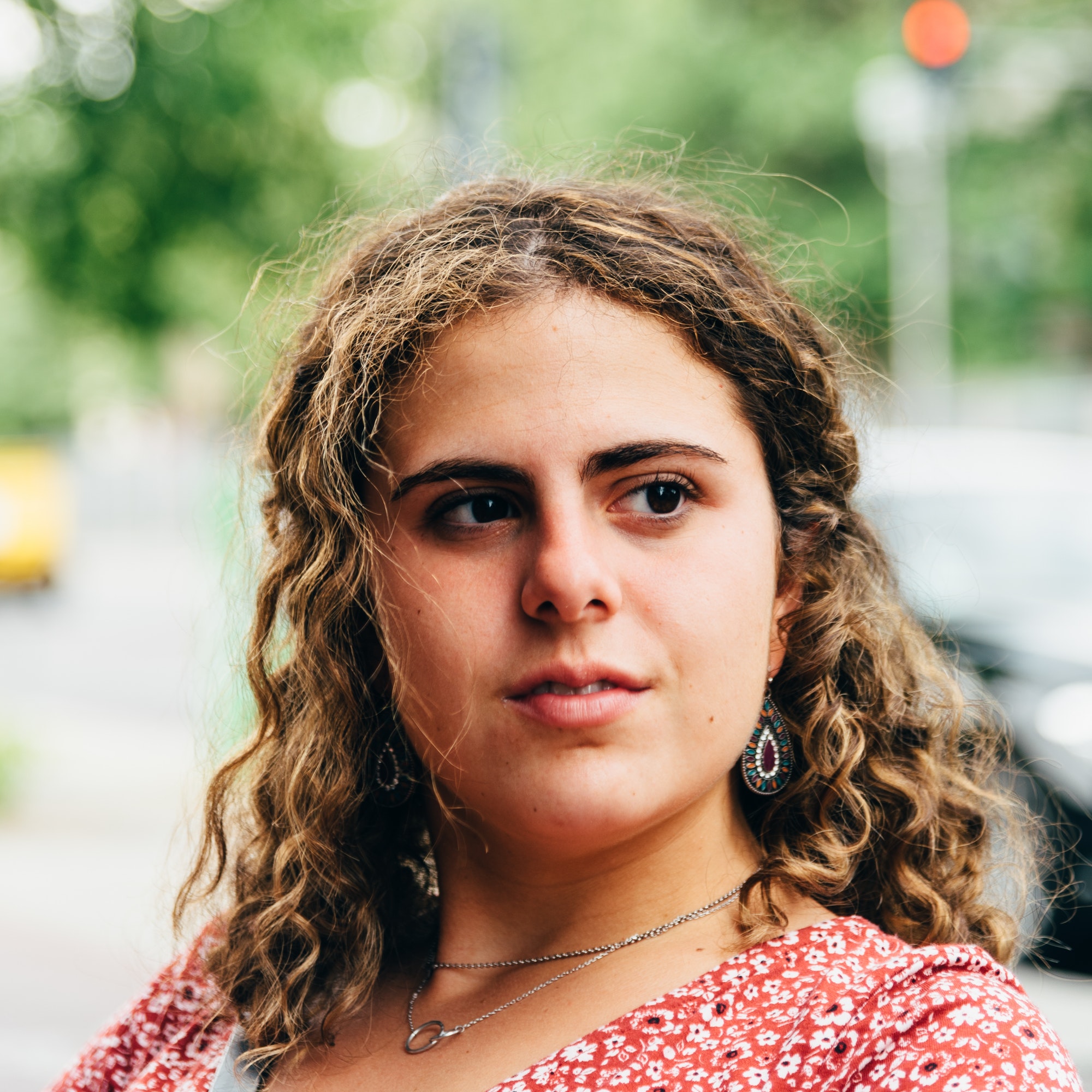 headshot-portrait-of-confident-beautiful-young-woman-with-curly-hair-.jpg